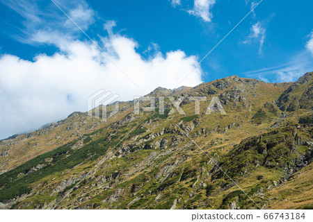 Breathtaking landscape in Carpathian mountains. With high green hills and rocks Breathtaking landscape in Carpathian mountains. With high green hills and rocks 66743184