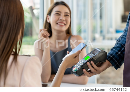 Asian customer make payment with contactless 66744132
