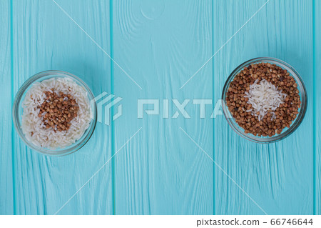 Cup of rice with buckwheat and cup of buckwheat with rice. 66746644