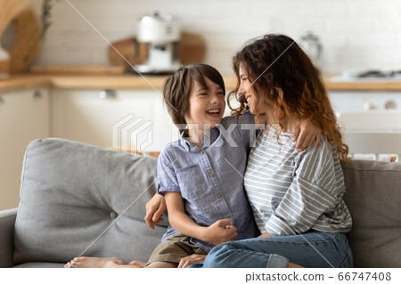 Smiling mother and little son hugging looking at each other. 66747408