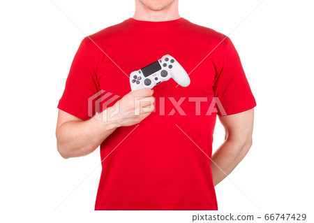 Man in red t-shirt holding video game joysticks Man in red t-shirt holding video game joysticks 66747429