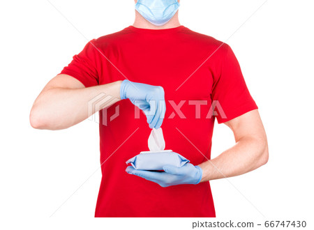 Man in red t-shirt, medical mask and gloves Man in red t-shirt, medical mask and gloves 66747430