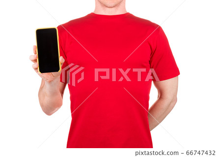 Man in red t-shirt holding mobile phone on his Man in red t-shirt holding mobile phone on his 66747432