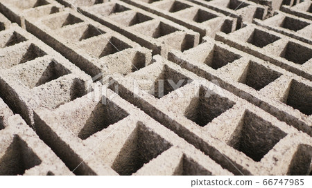 Brick forms. Production of bricks from volcanic ash in the Philippine city of Legazpi. Shooting in motion. 66747985