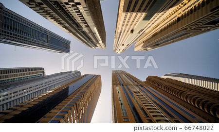 Residential skyscraper in Dubai on a sunny day. UAE. Residential skyscraper in Dubai on a sunny day. UAE. 66748022