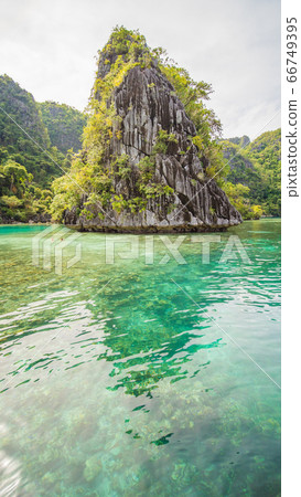 Twin Lagoon in Coron, Palawan, Philippines. Mountain and Sea. Lonely Boat. Tour A. Twin Lagoon in Coron, Palawan, Philippines. Mountain and Sea. Lonely Boat. Tour A. 66749395