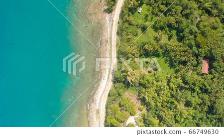 Curve winding road along the coast of the Philippines. Aerial views. Curve winding road along the coast of the Philippines. Aerial views. 66749630