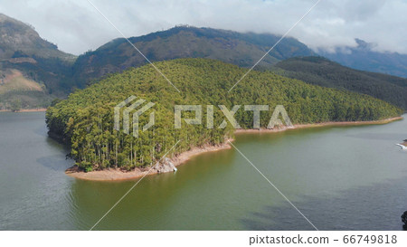 Aerial view beautiful nature with mountains and hills by Lake Mattupetty. Kerala State. Near the city of Munar. Aerial view beautiful nature with mountains and hills by Lake Mattupetty. Kerala State. Near the city of Munar. 66749818