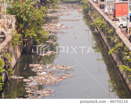Dirty river in Dharavi slums. Mumbai. India. 66750116