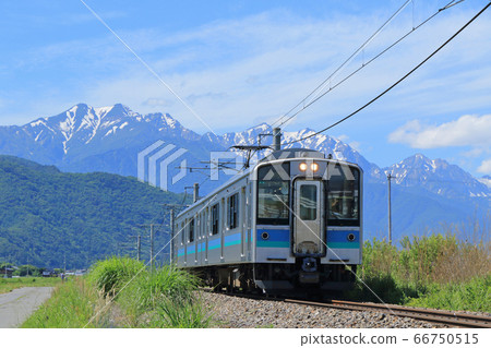 Oito Line Regular train in the afternoon going to the foot of the Northern Alps in early summer 66750515