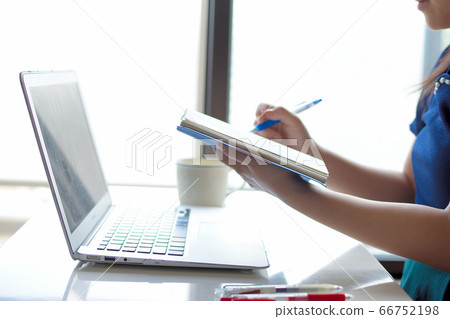 Woman working remotely 66752198