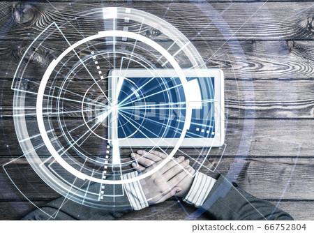 Business workplace with tablet device on wooden surface and media interface Business workplace with tablet device on wooden surface and media interface 66752804