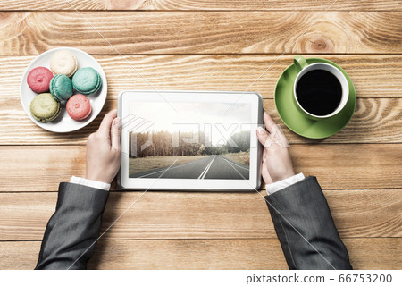 Businesswoman having coffee break Businesswoman having coffee break 66753200
