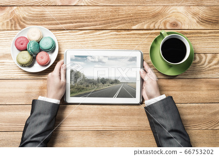 Businesswoman having coffee break Businesswoman having coffee break 66753202