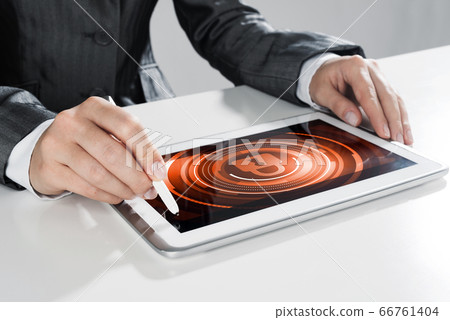 Internet security concept with woman working on media screen with stylus 66761404