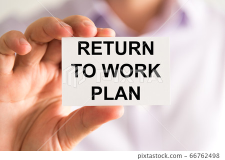 Businessman holding Returning To Work Plan message Businessman holding Returning To Work Plan message 66762498