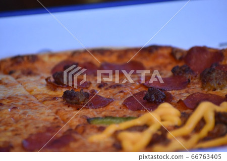 Pizza with thin dough, leaning Pizza with thin dough, leaning 66763405
