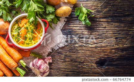 Chicken soup broth in a vintage bowl with homemade 66764774