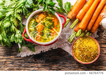 Chicken soup broth in a vintage bowl with homemade 66764776