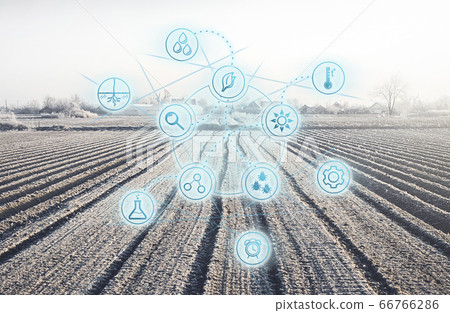 Futuristic innovative technology pictogram on a winter farm field. Agricultural startups, improvements, digitalization agricultural industry. Internet of things in farming. Preparing for next season Futuristic innovative technology pictogram on a winter farm field. Agricultural startups, improvements, digitalization agricultural industry. Internet of things in farming. Preparing for next season 66766286
