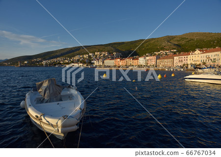 One-boat moored on the surface of the sea, with a sea-like forest of trees and castles. 66767034