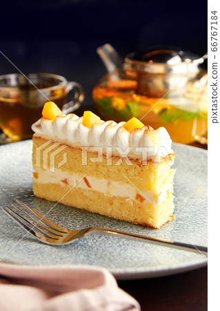 Piece of cake with pineapple and whipped cream. Piece of cake with pineapple and whipped cream. 66767184