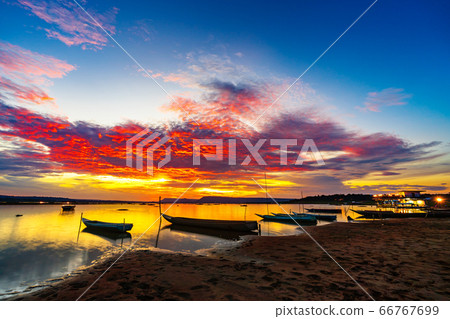 wooden boat at banks of the river with sunset in wooden boat at banks of the river with sunset in 66767699
