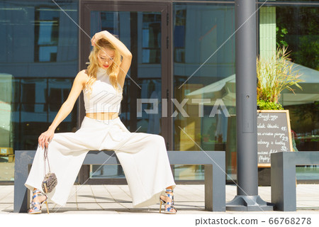 Woman wearing crop top and culottes Woman wearing crop top and culottes 66768278