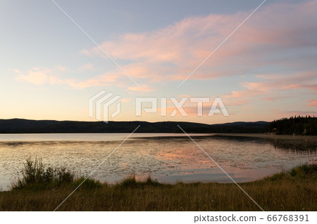 Alaska, sunset reflecting in the lake 66768391