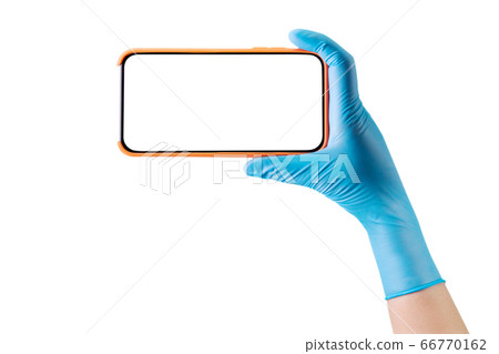 Doctor's hand in medical gloves holding phone and 66770162