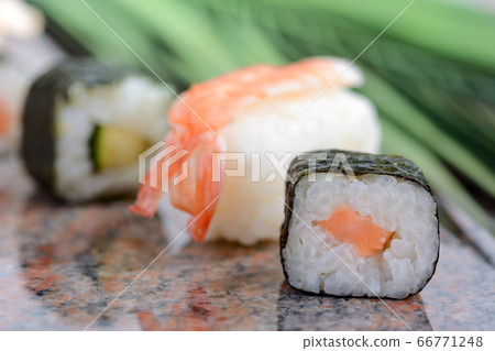 Asian sushi served on a marble plate Asian sushi served on a marble plate 66771248