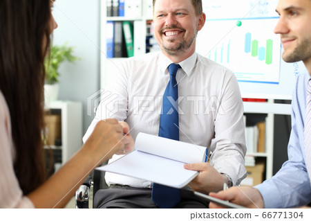 Cheerful business colleagues working in modern office Cheerful business colleagues working in modern office 66771304