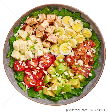 Cobb Salad in gray matte bowl isolated on white backdrop. USA food and meal  66773411