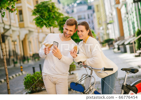 Happy smiling man taking selfie with woman on the street Happy smiling man taking selfie with woman on the street 66776454
