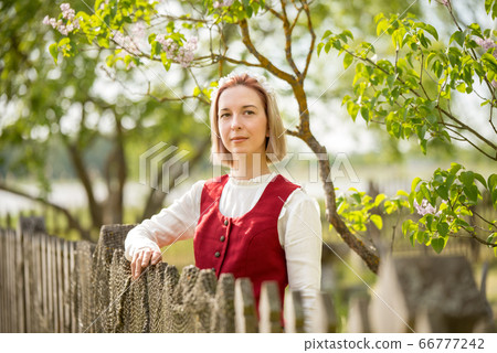 Latvian woman in traditional clothing. Ligo folk. Latvian woman in traditional clothing. Ligo folk. 66777242