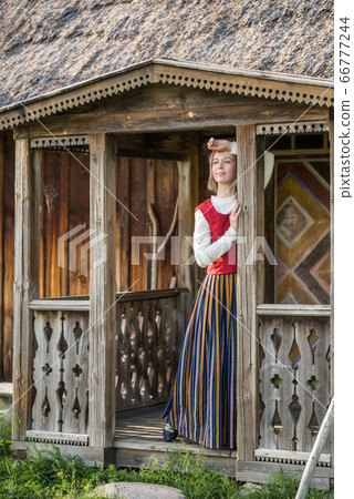 Latvian woman in traditional clothing. Ligo folk. Latvian woman in traditional clothing. Ligo folk. 66777244