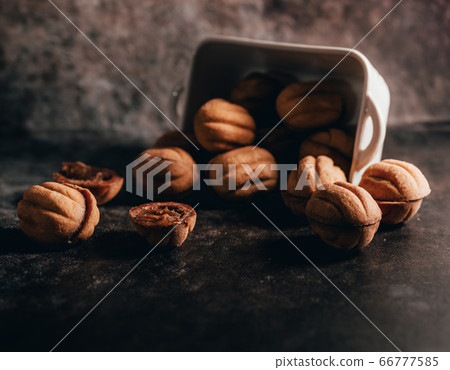 Homemade nut biscuits stuffed with caramel Homemade nut biscuits stuffed with caramel 66777585