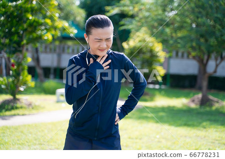 Portrait of Asian woman wearing earphones Portrait of Asian woman wearing earphones 66778231