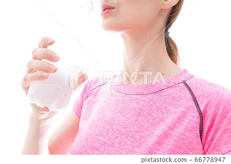 Young woman wearing sportswear to hydrate Young woman wearing sportswear to hydrate 66778947