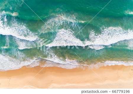 Aerial view sandy beach and crashing waves Aerial view sandy beach and crashing waves 66779196