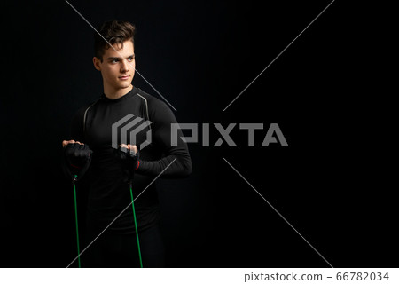 Young athlete with black t-shirt stands for picture Young athlete with black t-shirt stands for picture 66782034