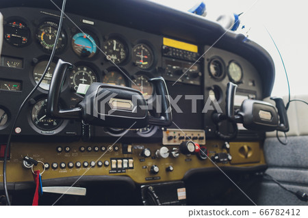Cockpit helicopter - Instruments panel. Interior of helicopter control dashboard, Heli on the ground. Blue colored. 66782412