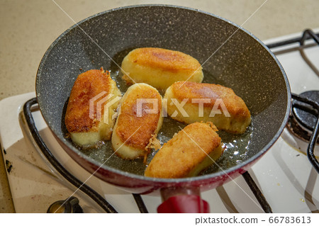 Potato cutlets with mushrooms in a pan Potato cutlets with mushrooms in a pan 66783613