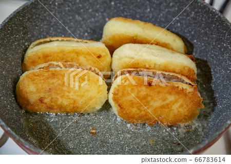 Potato cutlets with mushrooms in a pan Potato cutlets with mushrooms in a pan 66783614