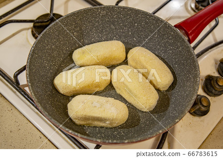 Potato cutlets with mushrooms in a pan Potato cutlets with mushrooms in a pan 66783615