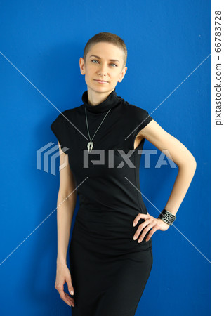 Fashionable employee in a black dress photographed Fashionable employee in a black dress photographed 66783728
