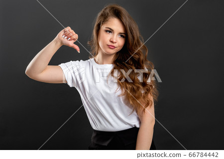 dislike gesture disappointed woman thumb down dislike gesture disappointed woman thumb down 66784442