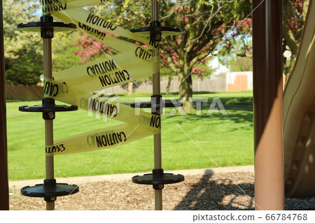 Empty children playground and swing during the coronavirus quarantine Empty children playground and swing during the coronavirus quarantine 66784768