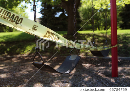 Empty children playground swing during the coronavirus quarantine Empty children playground swing during the coronavirus quarantine 66784769