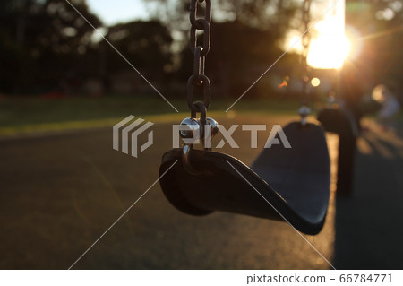 Empty children playground swing during the coronavirus quarantine 66784771